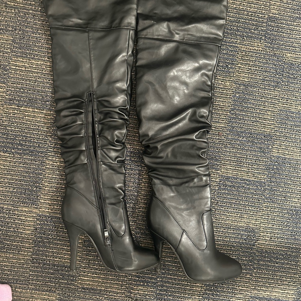 Black thigh high boots with small stiletto heel